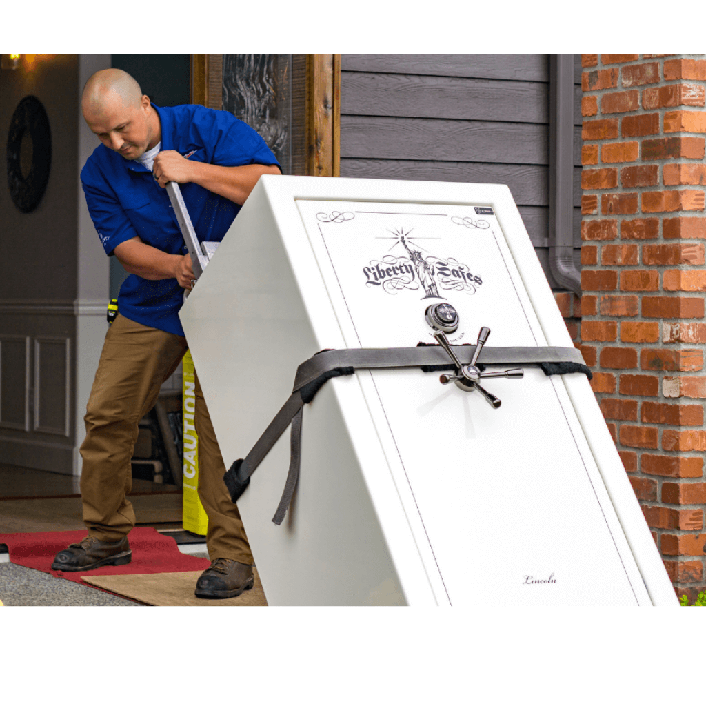 man moving safe upstairs